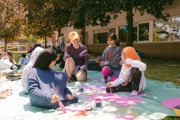 young changemakers painting outdoors